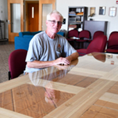 Vern Shafer at a table he made from bleachers