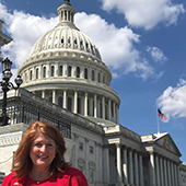 Lori Carrell in front of the U.S. capitol building