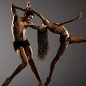 a man and woman performing ballet