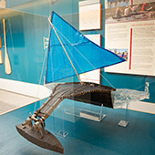 small canoe with sail exhibit