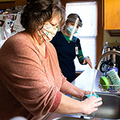 Michelle Hutchens washing dishes