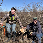 students clear brush