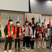 Crookston international students pose with sashes