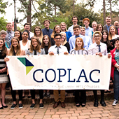 group holds COPLAC sign