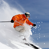 Person downhill skiing