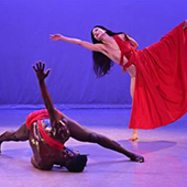 Two dancers on stage performing