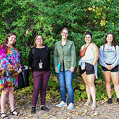Kristen Mastel and others in a forest area