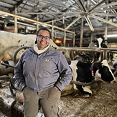 Dana Adams in a dairy barn