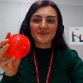 woman with red ball representative of covid virus