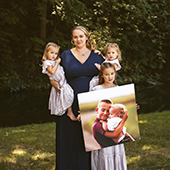Trista Curry and her 3 children holding photo of two deceased children