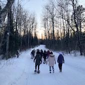 People walking on snowy trail