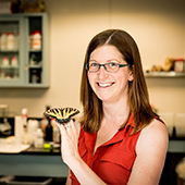 Emilie Snell Rood holding a butterfly
