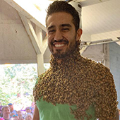 Josh Munoz covered in bees