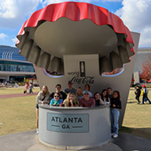 Students gather under giant Coke bottlecap in Atlanta