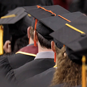 students wearing graduation caps and gowns