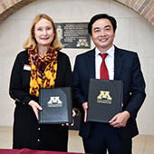 Mary Holz-Clause with president Hoang Van Phuc