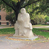 A statue at UMM honoring Natives