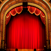 a stage with a red curtain