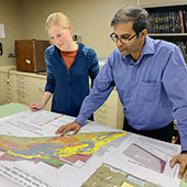 Natural Resources Research Institute (NRRI) geologists look at maps