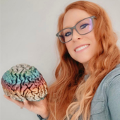 Karrie holding a human brain model