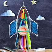 a rocket ship drawing made up of crayons 