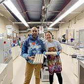 Lab services coordinator Lyndon Ramrattan and Helen Chen with a batch of white chocolate