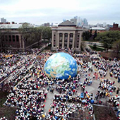 a huge globe of the earth on Northrop Mall with crowds gathered around