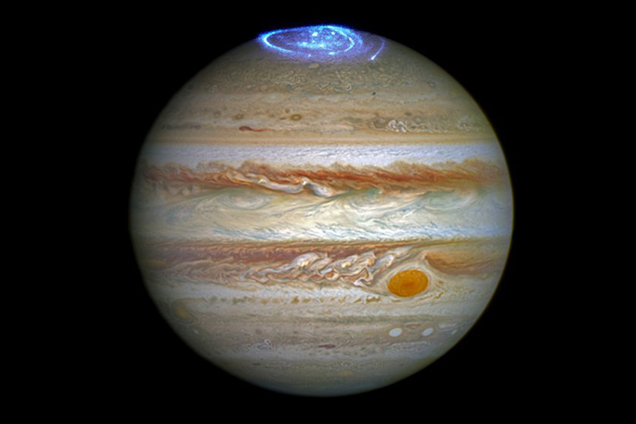Jupiter with an aurora highlighted in blue.
