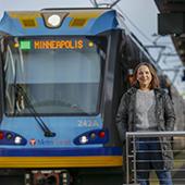 Alysha Alloway in front of lightrail